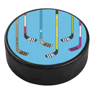 Colourful Hockey Sticks on blue Hockey Puck