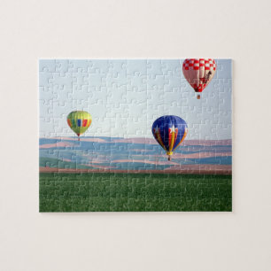 Colourful hot air balloons float over wheat jigsaw puzzle