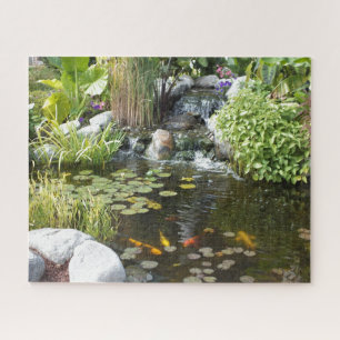 Colourful Koi in Lily pond with waterfall Jigsaw Puzzle