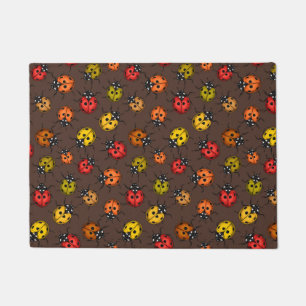 Colourful ladybugs on brown doormat