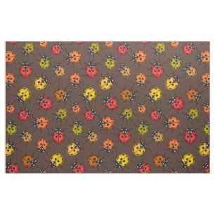 Colourful ladybugs on brown fabric
