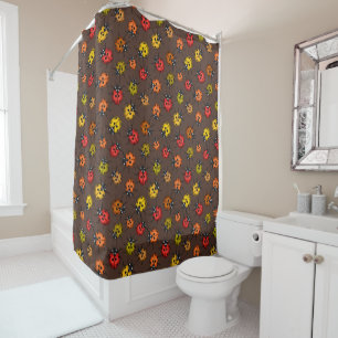 Colourful ladybugs on brown shower curtain