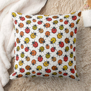 Colourful ladybugs on white cushion