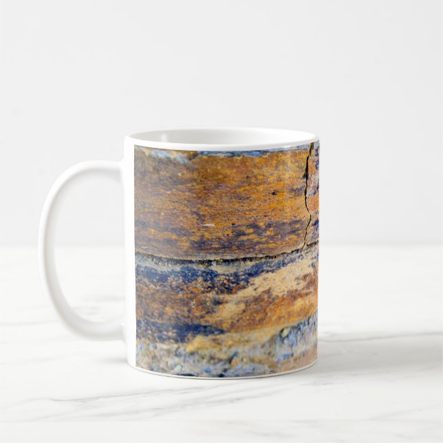 Colourful natural stone wall pattern in a quarryan coffee mug (Left)