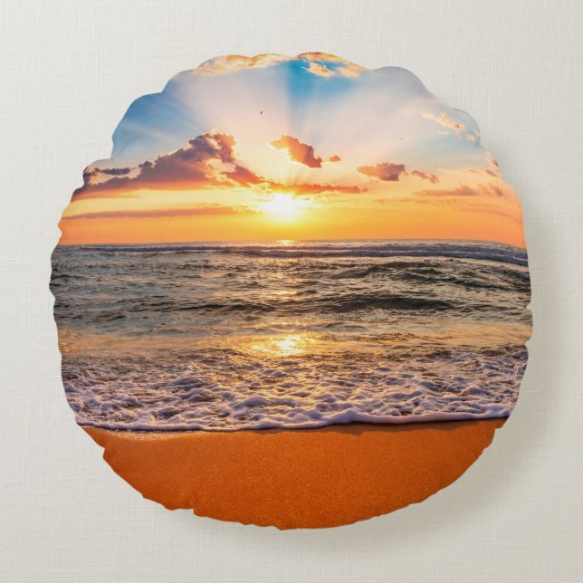 Colourful ocean beach sunrise with deep blue sky a round cushion (Front)