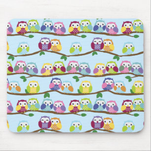 Colourful owls on a branch mouse mat