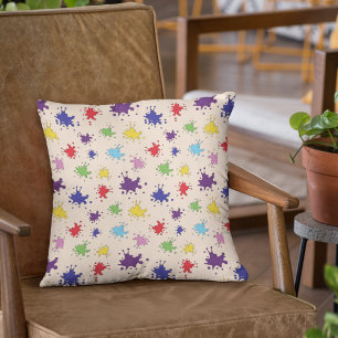 Colourful paint splatter design cushion