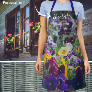 Colourful pansies in bloom in the country garden apron