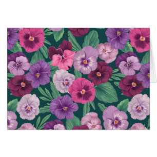Colourful pansies on dark greenish blue