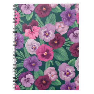 Colourful pansies on dark greenish blue notebook