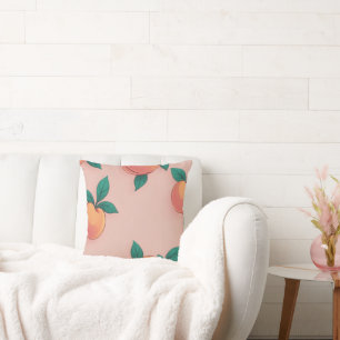 Colourful peach pattern on a soft pink background cushion