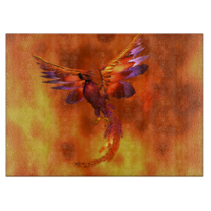 Colourful Phoenix Flying Against a Fiery Backgroun Cutting Board