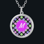 Colourful Retro Flower Pattern Monogram Silver Plated Necklace<br><div class="desc">This pretty, girly design features a bright, colourful floral pattern in shades of pink, purple, blue and green on a black background. It has a flower - shaped space in orchid - purple where you can add your monogram / initial in white to personalise. It's a slightly retro, very chic...</div>