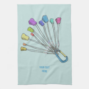 Colourful set of rock climbing nuts tea towel