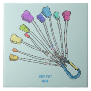 Colourful set of rock climbing nuts tile