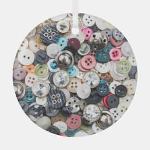 Colourful sewing buttons, natural fabric backgroun glass tree decoration