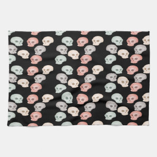 colourful skulls on black tea towel