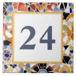Colourful Spanish Faux Mosaic House Door Number Tile<br><div class="desc">Please note: This is a faux mosaic. It is a printed graphic giving the illusion of mosaic stones. "custom house number plate", "personalised house no plaque", "personal customised text sign", "modern abstract design ceramic tile", "multicolored colourful gaudi mosaic", "building home apartment door", "bright vibrant yellow blue", "fun beautiful mediterranean mexican",...</div>