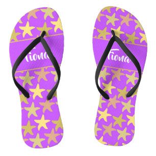 Colourful starfish on purple flip flops