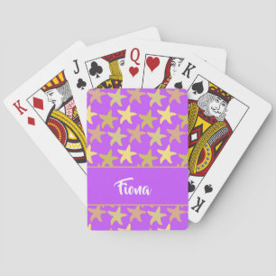 Colourful starfish on purple playing cards