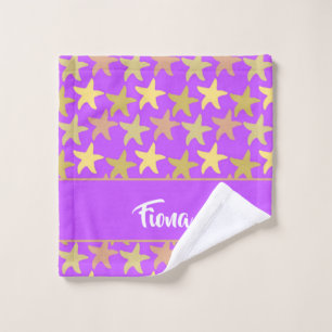 Colourful starfish on purple wash cloth