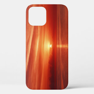 Colourful sunrise at sea, dramatic clouds. iPhone 12 case