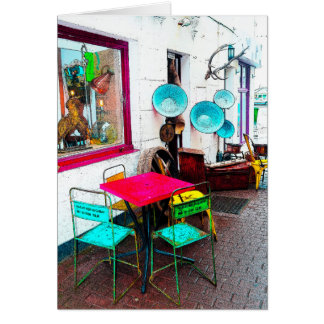 Colourful table and chairs in the alley way
