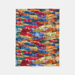 Colourful umbrellas in the sky blue orange red fleece blanket