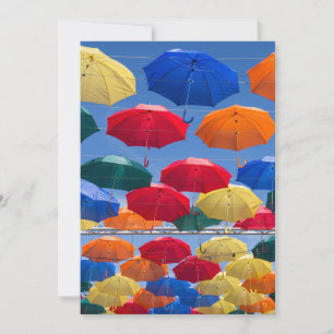 Colourful umbrellas in the sky blue orange red invitation