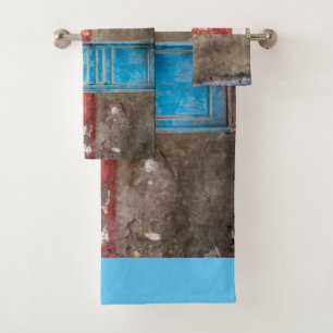 Colourful wall with blue door bath towel set