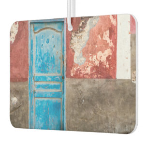 Colourful wall with blue door car air freshener