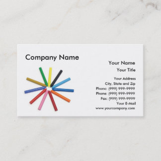 Colourful wax crayons arranged in star shape. business card