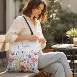 Colourful Wildflower Floral Personalised Name Tote Bag<br><div class="desc">Colourful Wildflower Floral Personalised Name Tote Bags features your custom personalised name in modern calligraphy script typography. Perfect for school,  work,  sports and home. Give a personalised gift for Christmas,  birthday,  holidays,  Mothers' Day to mum,  sister,  best friends,  teachers and more. Designed by Evco Studio www.zazzle.com/store/evcostudio</div>