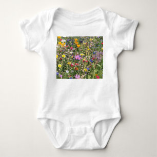 Colourful wildflower meadow, vibrant pattern. baby bodysuit