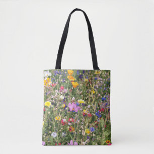 Colourful wildflower meadow, vibrant pattern. tote bag