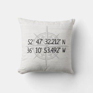 Compass GPS Home Coordinates On Wood Cushion