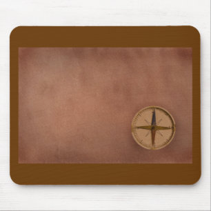compass on old paper mouse mat