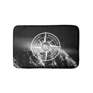 Compass star emblem monogram dramatic mountains bath mat