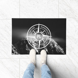 Compass star emblem monogram dramatic mountains doormat