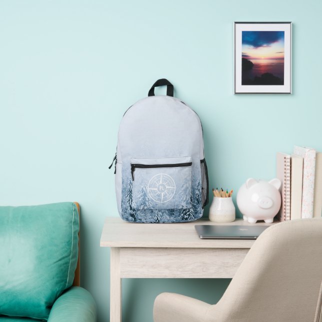 Compass star emblem monogram winter spruce forest printed backpack (Insitu)