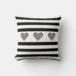 Concentric hearts on black & white striped cushion