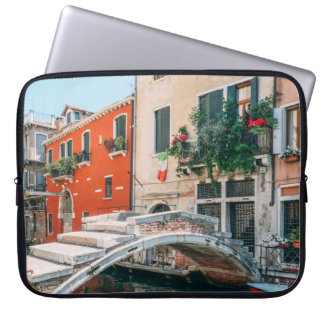 CONCRETE BRIDGE BESIDE WHITE BUILDING LAPTOP SLEEVE