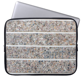Concrete pebbles wall laptop sleeve