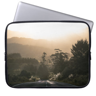 CONCRETE ROAD SURROUNDED BY TREES LAPTOP SLEEVE