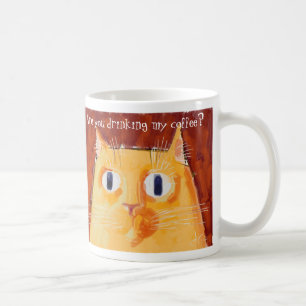 Confrontational orange cat with round eyes coffee mug