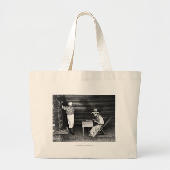 Cook watching a cowboy play cards large tote bag (Front)