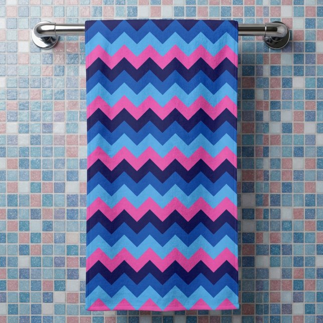 Cool Blue Pink Chevron Pattern Bath Towel (Cool Blue Pink Chevron Pattern Bath Towel hanging on a rack in a bathroom against tiled wall.)