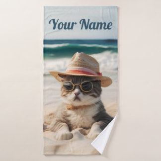 Cool cat on the beach with sunglasses and hat. bath towel