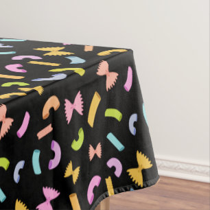 Cool fun pasta macaroni colourful pattern on black tablecloth