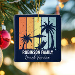 Cool Retro Beach Vacation Custom Blue Christmas Ceramic Ornament<br><div class="desc">Personalised navy blue beach Christmas ornament keepsake for your family trip to Hawaii, Florida, or other tropical island destinations. Cool palm trees sway against retro colours of orange and yellow above your customised vacation name in white script. Matching gifts are great for a group going on a cruise or coastal...</div>